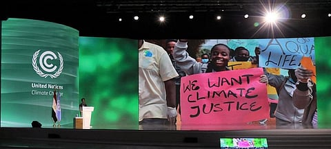 A climate activist from Uganda at COP27. Photo: UN News.