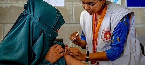 A teenage girl receives her second dose of the COVID-19 vaccine in Bhasan Char in Bangladesh. Photo: UN News.