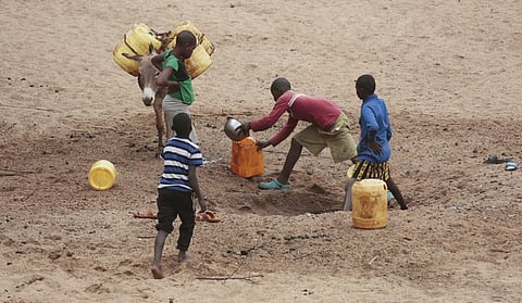 Children who have dropped out of school to join their parents in search of food and water in Northern Kenya, which is experiencing prolonged droughts. Photo: Tony Malesi