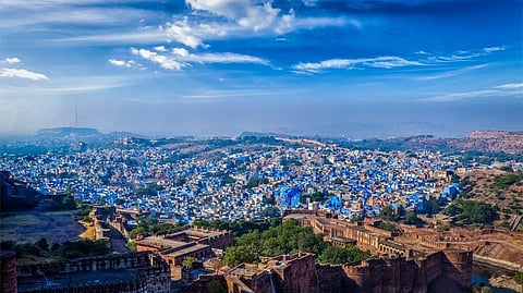 Passive cooling strategies for buildings in cities can reduce energy usage by 20-30 per cent by 2038. (In picture: Jodhpur's houses painted in distinct blue to keep them cool. Photo: iStock)