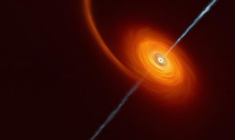 This artist’s impression illustrates how it might look when a star approaches too close to a black hole and gets squeezed by its intense gravitational pull. Illustration: ESO/M Kornmesser