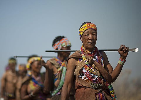 Descendants of the indigenous San people in the Kalahari Desert. Photo: Eric Lafforgue/Gamma-Rapho via Getty Image