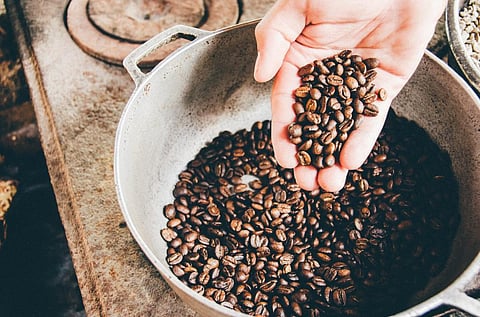 Scientists say that wasting coffee and water while making a cup of coffee has a larger carbon footprint than using coffee capsules. (Unsplash)
