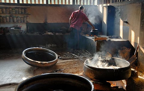 Medicine and oils being cooked traditionaly over an open fire in an Ayurvedic pharmacy. Photo: iStock
