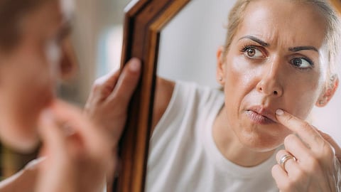Those with body dysmorphic disorder often check themselves – and their perceived defects. Photo: Stevica Mrdja / EyeEm via Getty Images