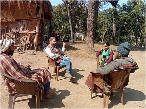 Heads of Van Gujjar tribes (lambardars) from Uttar Pradesh talking to Himalayan tribal rights activist Avdhesh Sharma on permit approval for yearly migration. Photo: Sonali Sharma