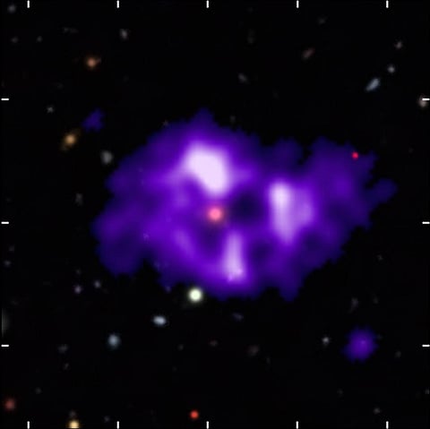 SAURON: radio intensity (purple) from MeerKAT overlaid on an optical image from the Dark Energy Survey. Photo: Michelle Lochner / The Dark Energy Survey Collaboration 2005