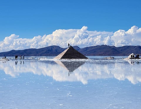 A salt pyramid in Uyuni, Bolivia. The rainy season produces a mirror effect in the salt flat. Photo: Mario Orospe Hernandez, CC BY-NC-ND