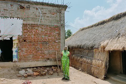 Saraswati Mohanty, a resident of the Baghpatia Colony, in front of her partially constructed house. Photo: ActionAid