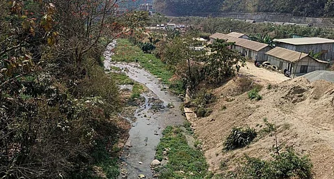 The Chite Lui River has turned into a small stream due to encroachments on its banks. Photo by Gurvinder Singh