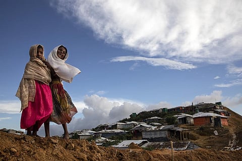 Rohingya girls share a laugh in Kutupalong, the world’s largest refugee camp in Bangladesh. Paula Bronstein/Getty Images