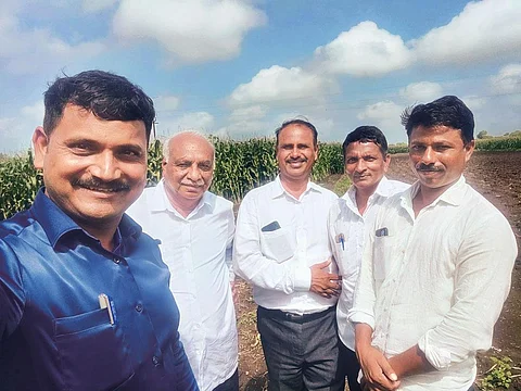 Baban Nanabhau Fand Patil (extreme left), a founder of The Maharashtra Onion Farmers Group, with farmer-members of the network