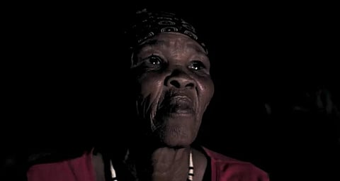 Cakase Kruiper, a San elder, explains her connection to the cosmos in the film !Aitsa. © Dane Dodds and Med_Cine