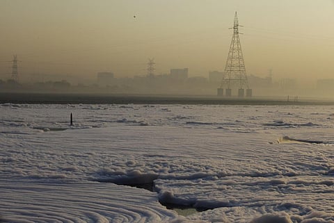 The polluted Yamuna river covered in a thick blanket of toxic foam. Photo: iStock