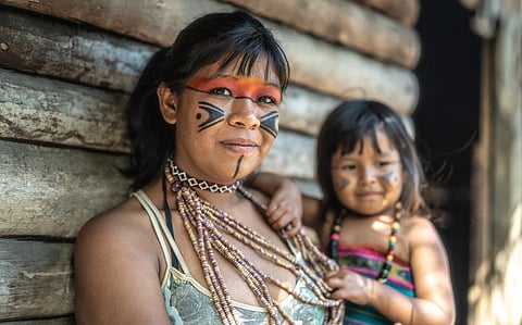 An Indigenous Brazilian young woman of Tupi Guarani ethnicity, with her child. Photo: iStock
