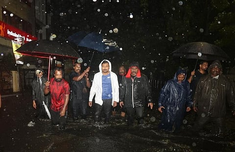 DMK leader Udhayanidhi Stalin wades through water in Chennai on December 3 night. Photo: @Udhaystalin / X