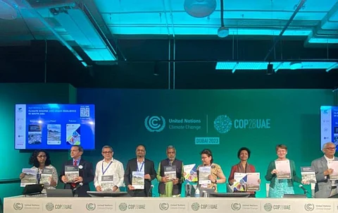 The event at COP28 in Dubai where Kolkata placed a demand for loss and damage funds. CSE's Anumita Roychowdhury is third from right. Debashish Kumar is in the centre, in the green tunic. Photo: Jayanta Basu