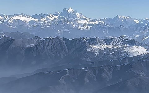 The naked, snow-less peaks of the Pir Panjal Range that separates Jammu from the Kashmir Valley. This photo was captured by Kashmiri environmentalist Raja Muzaffar Bhat as his flight passed over the Banihal Pass, the gateway to Kashmir on January 7, 2024. The snow-covered peak in the background is Nun Kun, near Leh