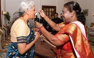 President Draupadi Murmu gives sugar and curd to Finance Minister Nirmala Sitharaman just before she delivers the budget. Photo: @rashtrapatibhvn / X
