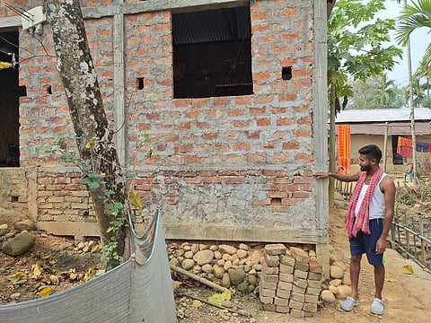 Manojit Das, a fisherperson from Mahadevpur Part 1 village, Cachar, Assam, used the lion's share of his PMAY-G benefits to raise his house 4 feet above the ground. Photo: Rohini Krishnamurthy / CSE