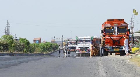 A mirage appears as vehicles ply on a road in Beawar, Rajasthan, during a hot summer day in May 2020.