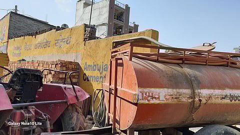 Delhi Jal Board water is available in a limited quantity in Sangam Vihar, resulting in a monopoly by tanker operators.