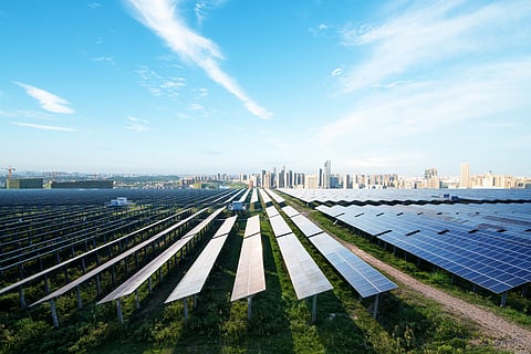 solar panel with cityscape in background
