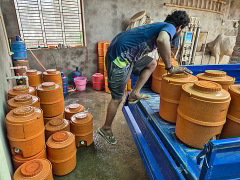 Campers of cool, RO-filtered water being prepared for supply in a Bundelkhand town.