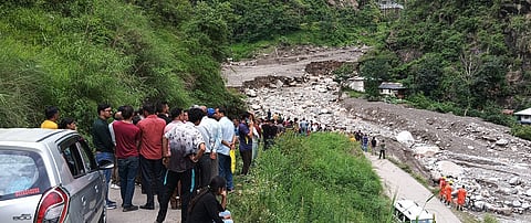 Scene after cloudburst in Shimla’s Samej village, with relief workers engaged in rescue work.