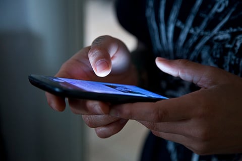 Hands holding a smartphone