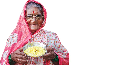 Kusum Gaikwad of Jambhali village, Kolhapur district, Maharashtra with a porridge made from indigenous kabburi makka variety of maize