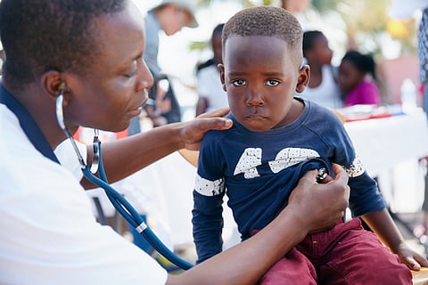 Representative image of a doctor giving checkups to kid