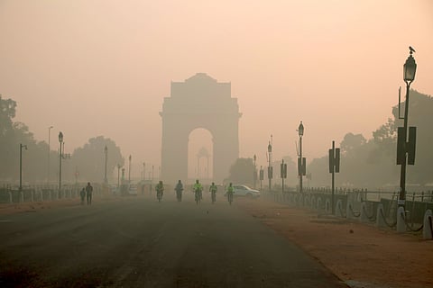 Image of India gate partially visible due to smog