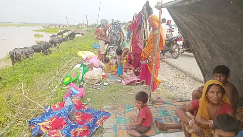 Thousands of displaced residents are facing severe shortages of relief materials, with many forced to shelter under makeshift plastic coverings