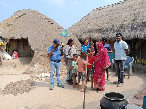 A family from the seaside village of Magarkandha prepares to head towards the cyclone shelter.