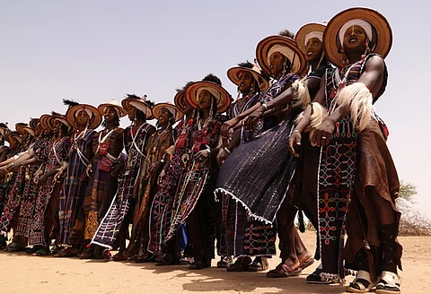 Wodaabe men performing the Yaake dance in Niger. The Wodaabe are a subgroup of the Fulani.