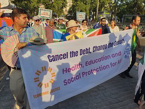Protests demanding debt cancelling at the ongoing FfD4 in Spain.