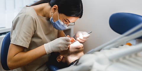 dentist working on a patient's teeth