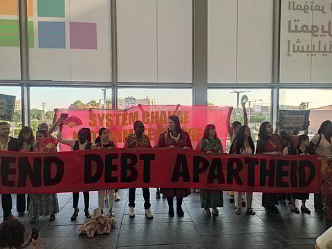 Protests by civil society at FfD4 demanding debt cancellation.