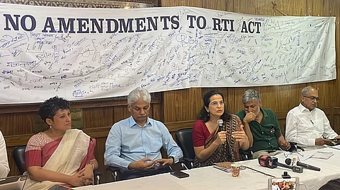 Sangeeta Barooah Pisharoty, Anjali Bhardwaj, Nikhil Dey and Prashant Bhushan along with other activists at the Press Club of India venue in Delhi.
