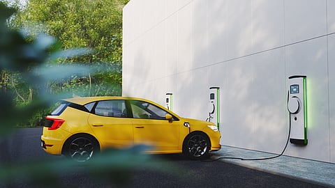 an electric vehicle charging at an station