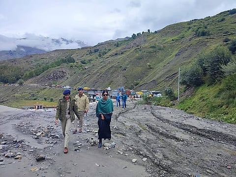Officials visiting the affected area after Paagal Nala overflowed in Lahaul-Spiti district.
