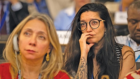 Delegates from Mexico, who pushed for a phase-out of problematic plastics, look dejected during the closing plenary in Geneva on August 15, which ended without any outcome