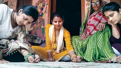 Rakhi Jha (extreme left), a Mithila painting artist and resident of Madhepur village in Madhubani district, used government assistance to set up a painting outlet.