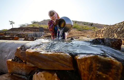 Labourers working for a water conservation project under the Mahatma Gandhi National Rural Employment Guarantee Act (MGNREGA) in Rajasthan’s Dungarpur district in 2021.