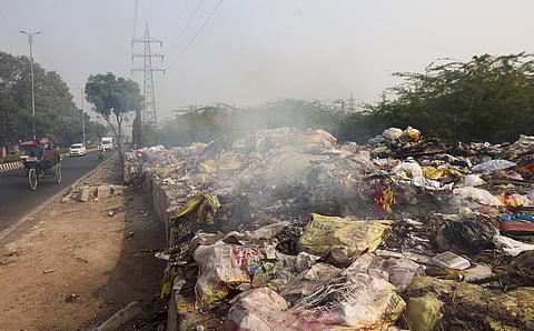 Delhi burns its waste openly, chokes itself more