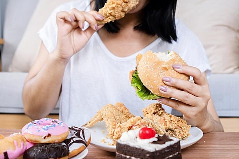 Feelings of isolation may trigger responses in the brain that promote unhealthy eating patterns. Photo: iStock