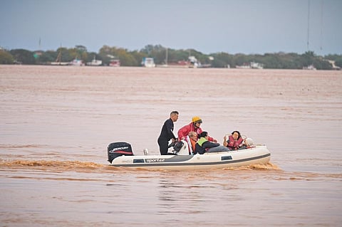 People being rescued in flood-hit Rio Grande do Sul, southern Brazil. Photo shared by @EduardoLeite_ / X