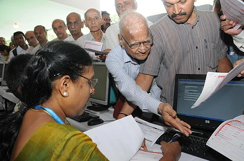 senior citizen paying tax