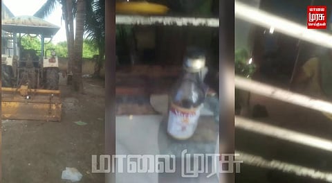 காவல் நிலையம் அருகிலேயே மது விற்பனை செய்யும் பெண்... வைரல்  வீடியோ...